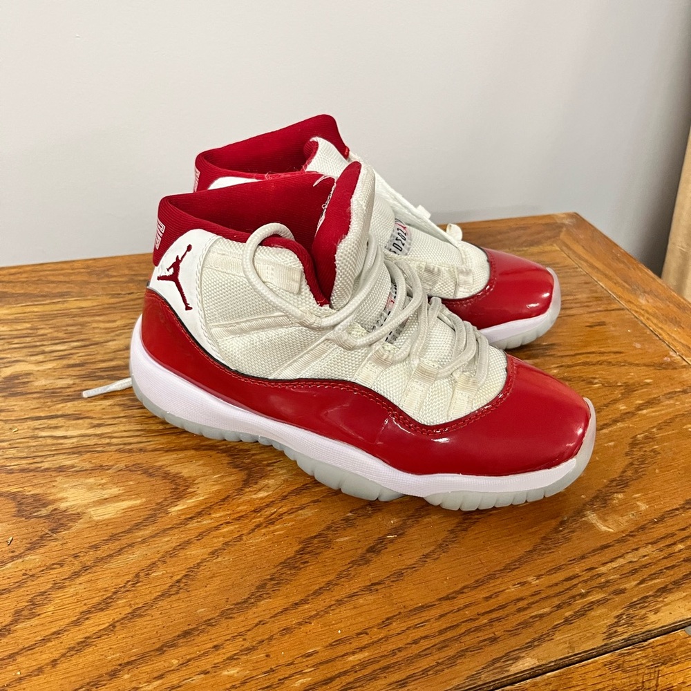 Air Jordan 11 Kids Red and White Sneakers lace up